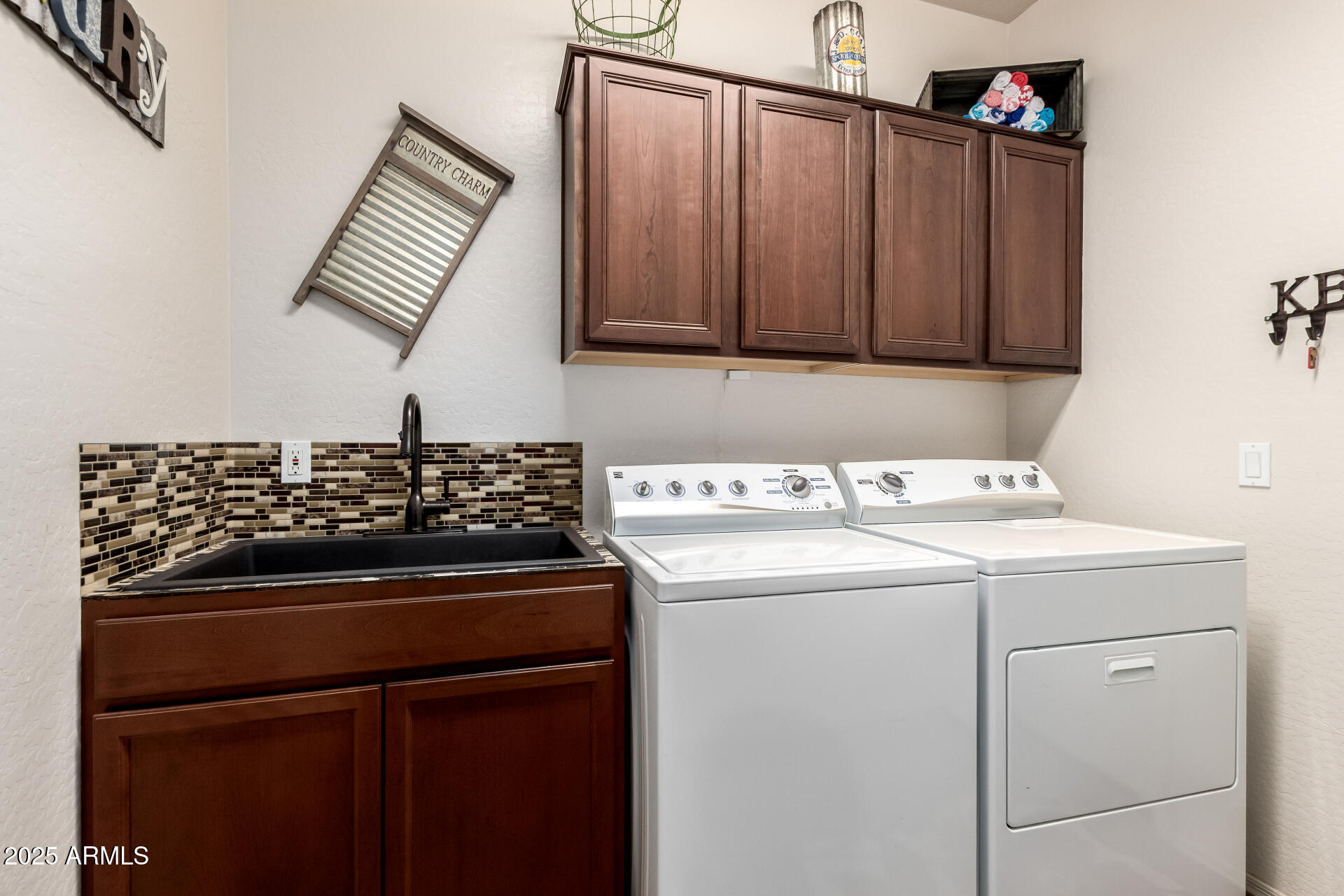 18115 West Desert View Lane Goodyear, AZ 85338 - Photo 28 of 57 a utility room with dryer and washer
