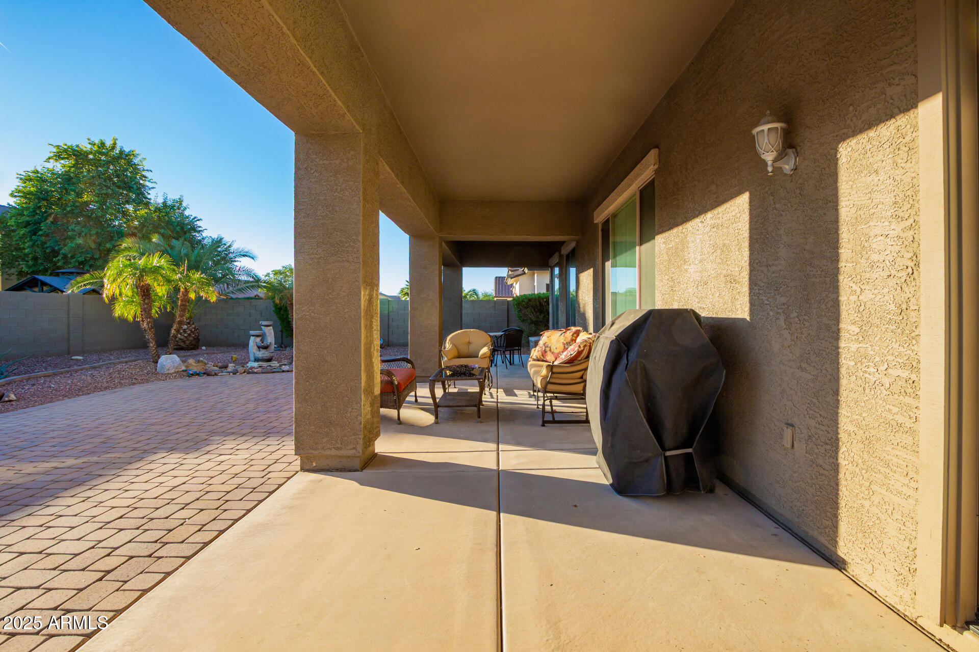 18115 West Desert View Lane Goodyear, AZ 85338 - Photo 29 of 57 a building outdoor space with patio furniture and potted plants