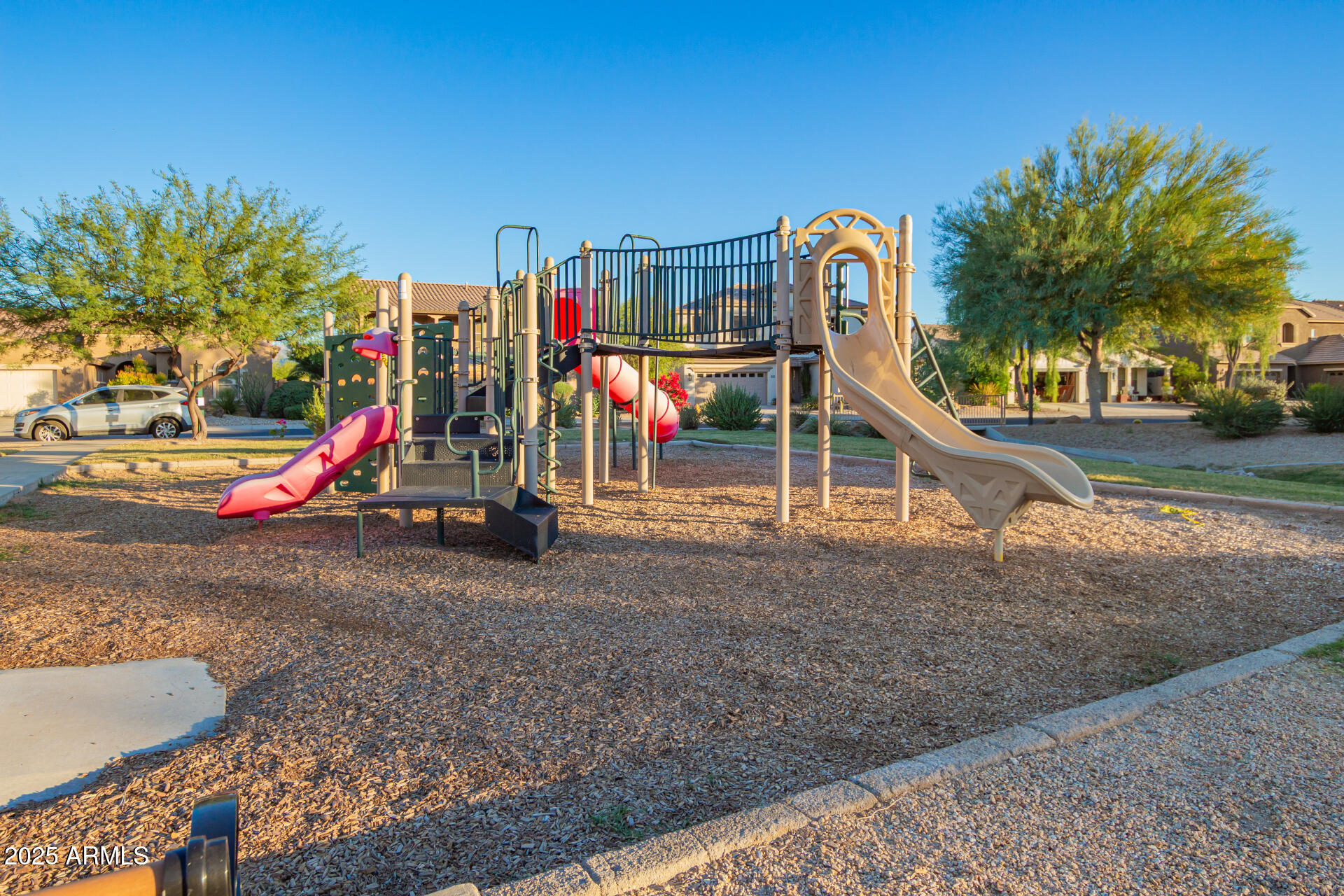 18115 West Desert View Lane Goodyear, AZ 85338 - Photo 36 of 57 a view of a park with slide and entertaining space