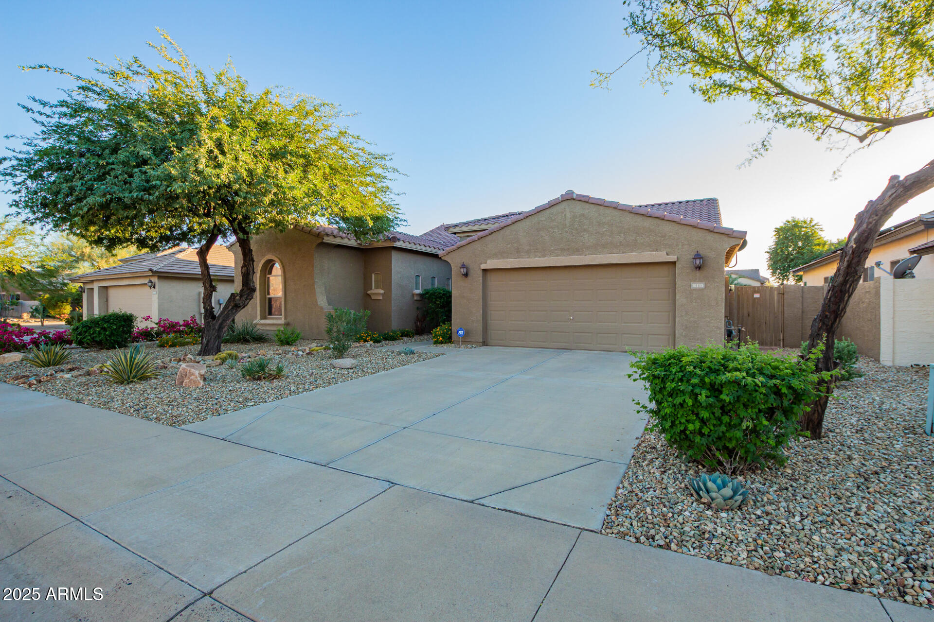 18115 West Desert View Lane Goodyear, AZ 85338 - Photo 4 of 57 a front view of a house with garden