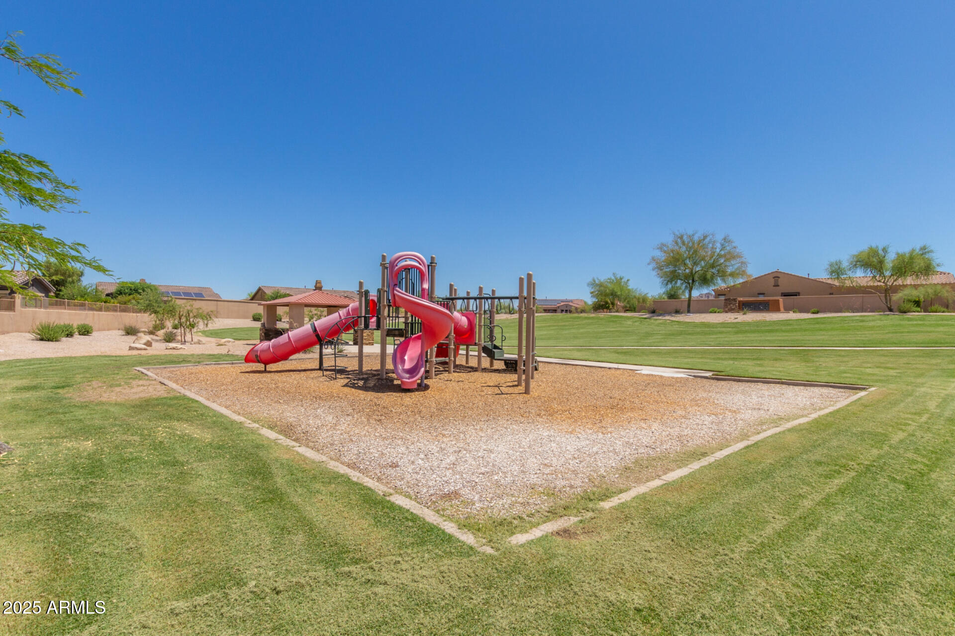 18115 West Desert View Lane Goodyear, AZ 85338 - Photo 44 of 57 a childrens park with lots of swings and slides