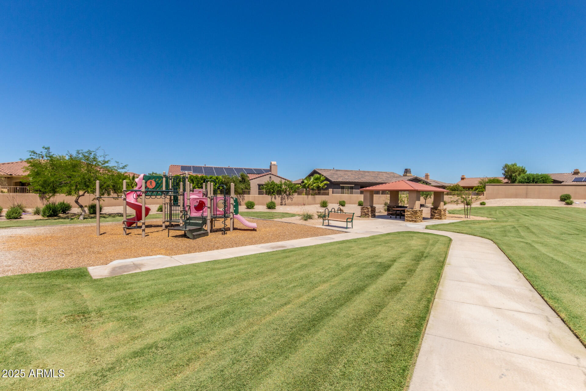 18115 West Desert View Lane Goodyear, AZ 85338 - Photo 45 of 57 a view of swimming pool with lawn chairs and a yard