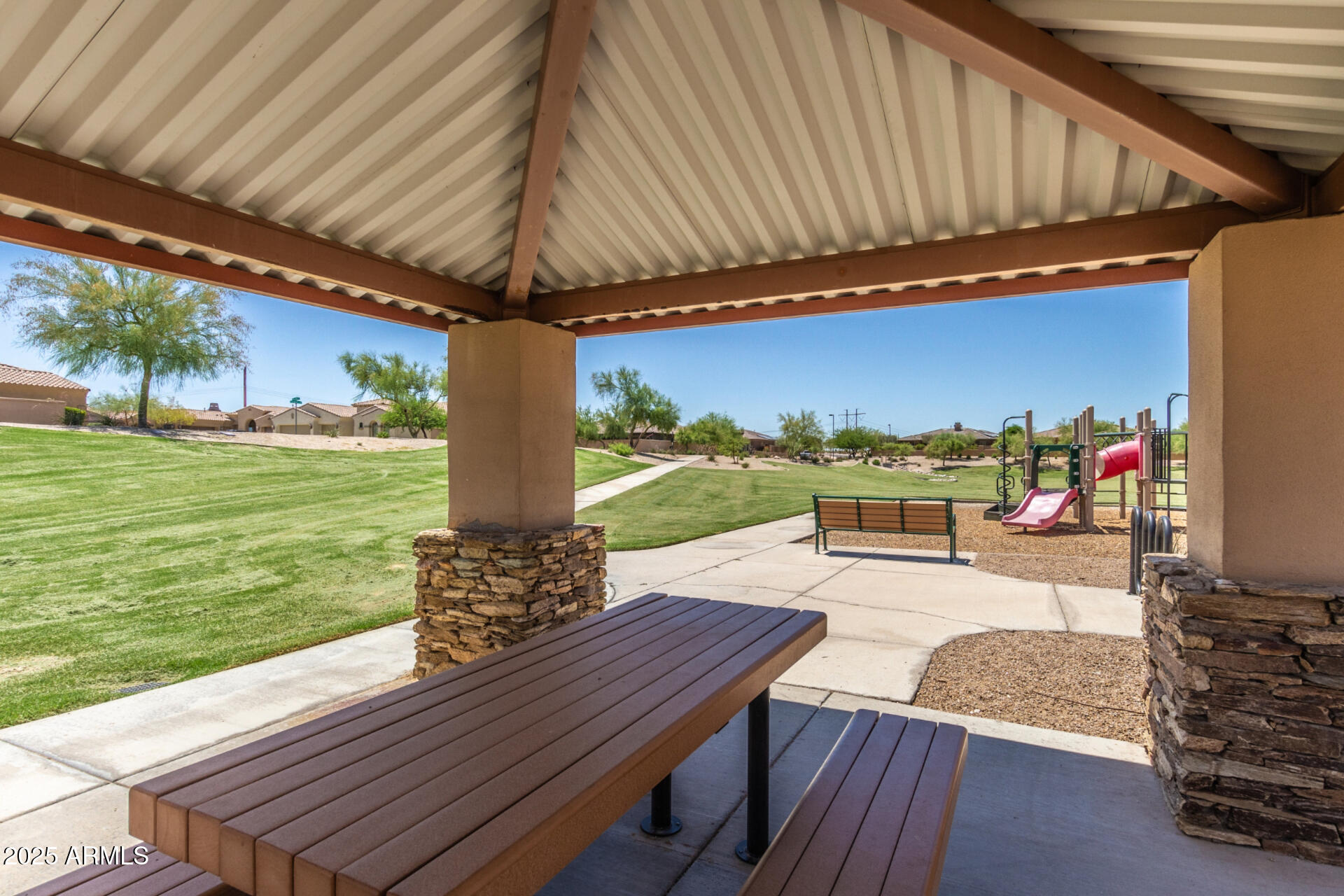 18115 West Desert View Lane Goodyear, AZ 85338 - Photo 46 of 57 a view of a patio with a table chairs and a patio