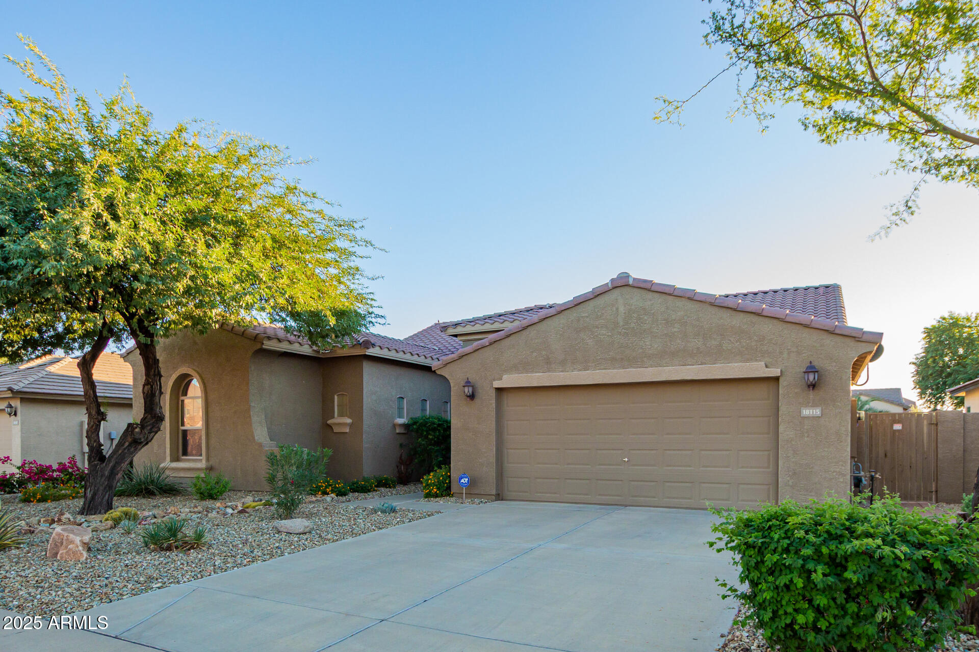 18115 West Desert View Lane Goodyear, AZ 85338 - Photo 5 of 57 a front view of a house with a garage
