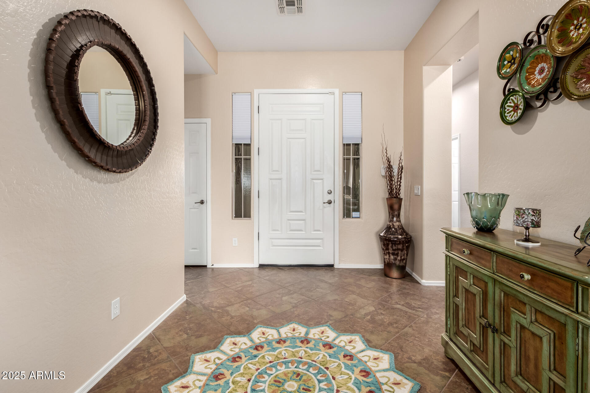 18115 West Desert View Lane Goodyear, AZ 85338 - Photo 7 of 57 a view of livingroom with furniture and front door