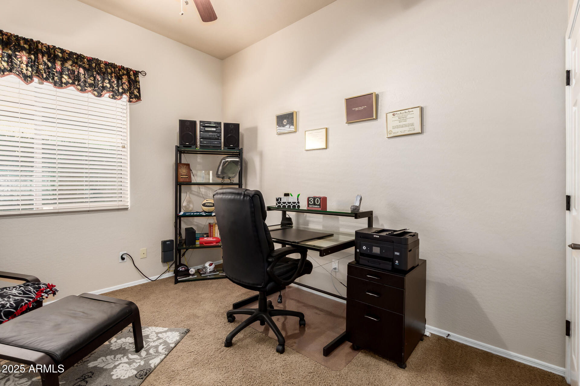 18115 West Desert View Lane Goodyear, AZ 85338 - Photo 8 of 57 a view of a workspace with furniture and a window