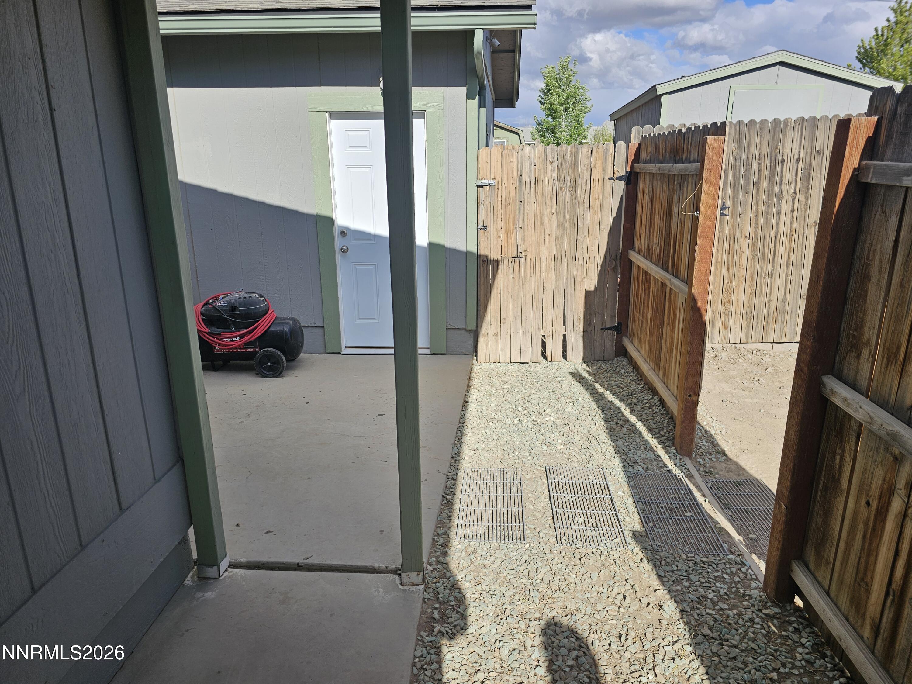 1125 Rancho Road Fernley, NV 89408 - Photo 31 of 47 a view of a door and outdoor space