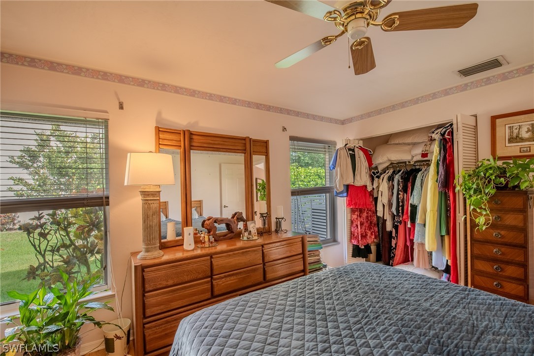 7181 Appleby Drive Naples, FL 34104 - Photo 19 of 29 a bedroom with furniture and a large window