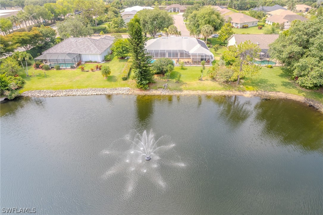 7181 Appleby Drive Naples, FL 34104 - Photo 2 of 29 a view of a lake with a big yard