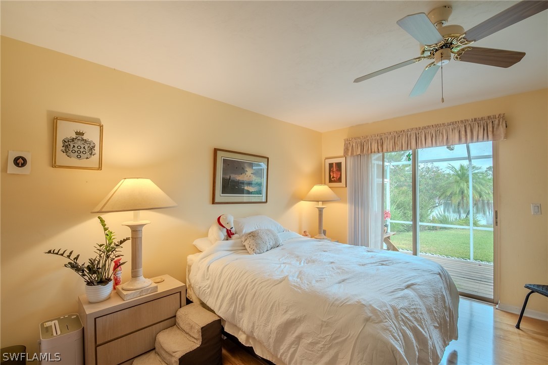 7181 Appleby Drive Naples, FL 34104 - Photo 23 of 29 a bedroom with a bed and a window