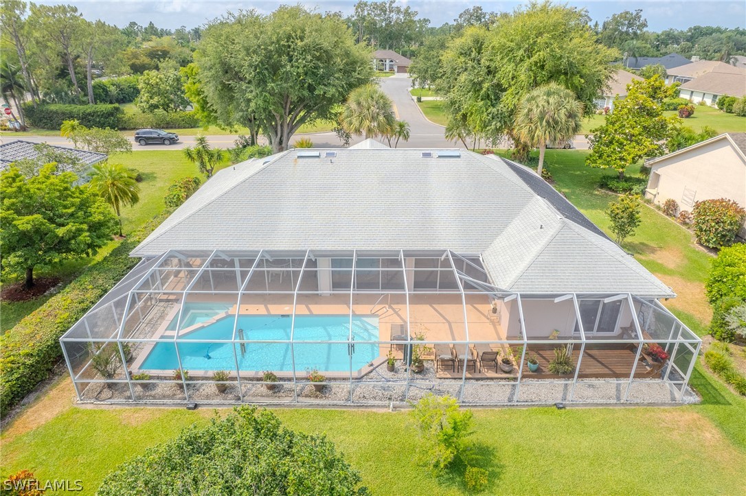 7181 Appleby Drive Naples, FL 34104 - Photo 27 of 29 an aerial view of a house with a yard and lake view