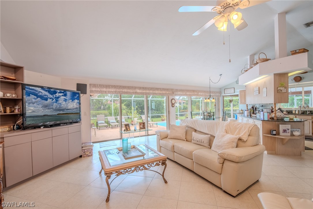 7181 Appleby Drive Naples, FL 34104 - Photo 5 of 29 a living room with furniture and a flat screen tv