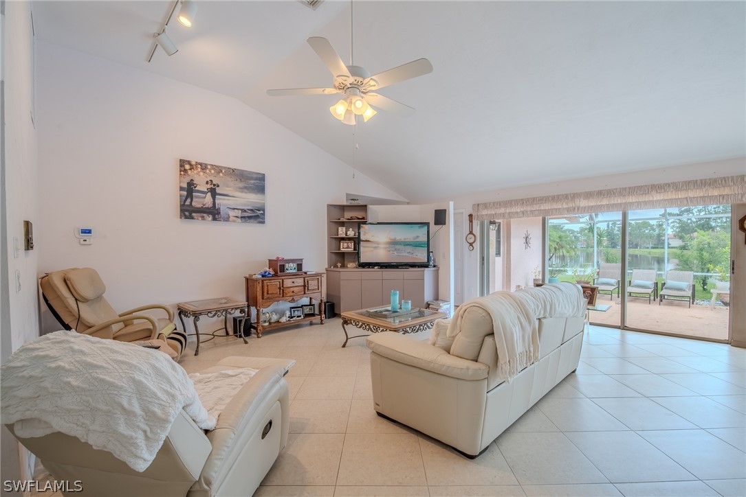 7181 Appleby Drive Naples, FL 34104 - Photo 6 of 29 a living room with furniture and a large window