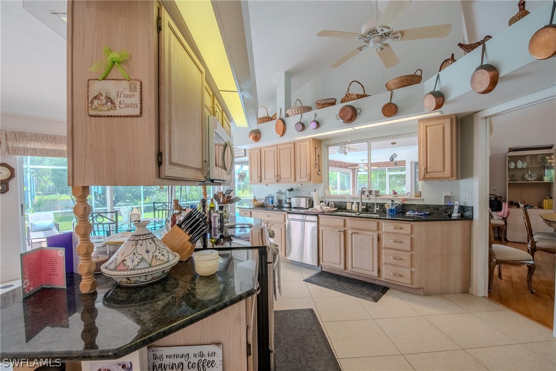7181 Appleby Drive Naples, FL 34104 - Photo 8 of 29 a kitchen with granite countertop lots of counter top space