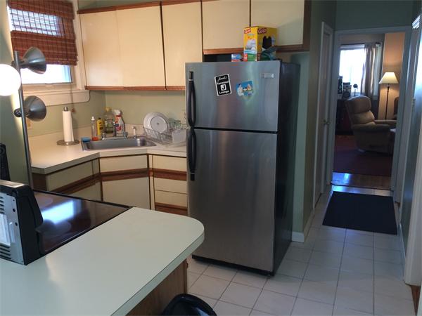 3 Prescott Street Boston, MA 02128 - Photo 3 of 8 a kitchen with a refrigerator and a stove