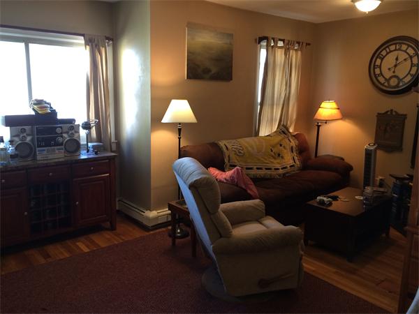 3 Prescott Street Boston, MA 02128 - Photo 6 of 8 a bed room with furniture and a lamp