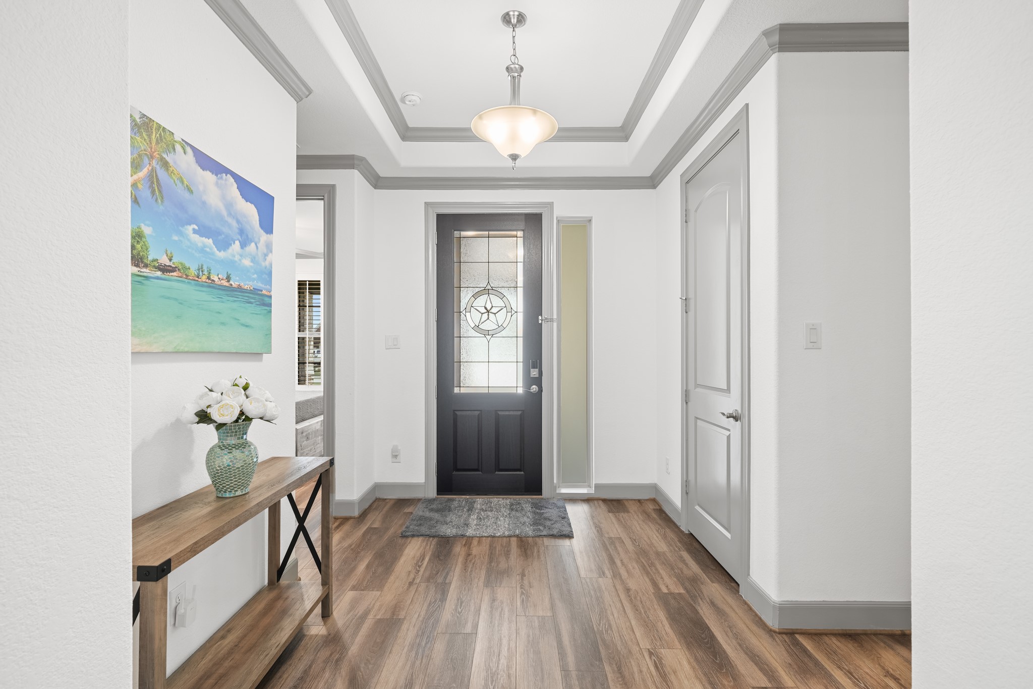 5739 Bobwhite Trail Manvel, TX 77578 - Photo 29 of 29 A welcoming foyer with tray ceilings creates an elegant first impression the moment you step inside. The spacious entry sets the tone for the home's open, thoughtfully designed floor plan.