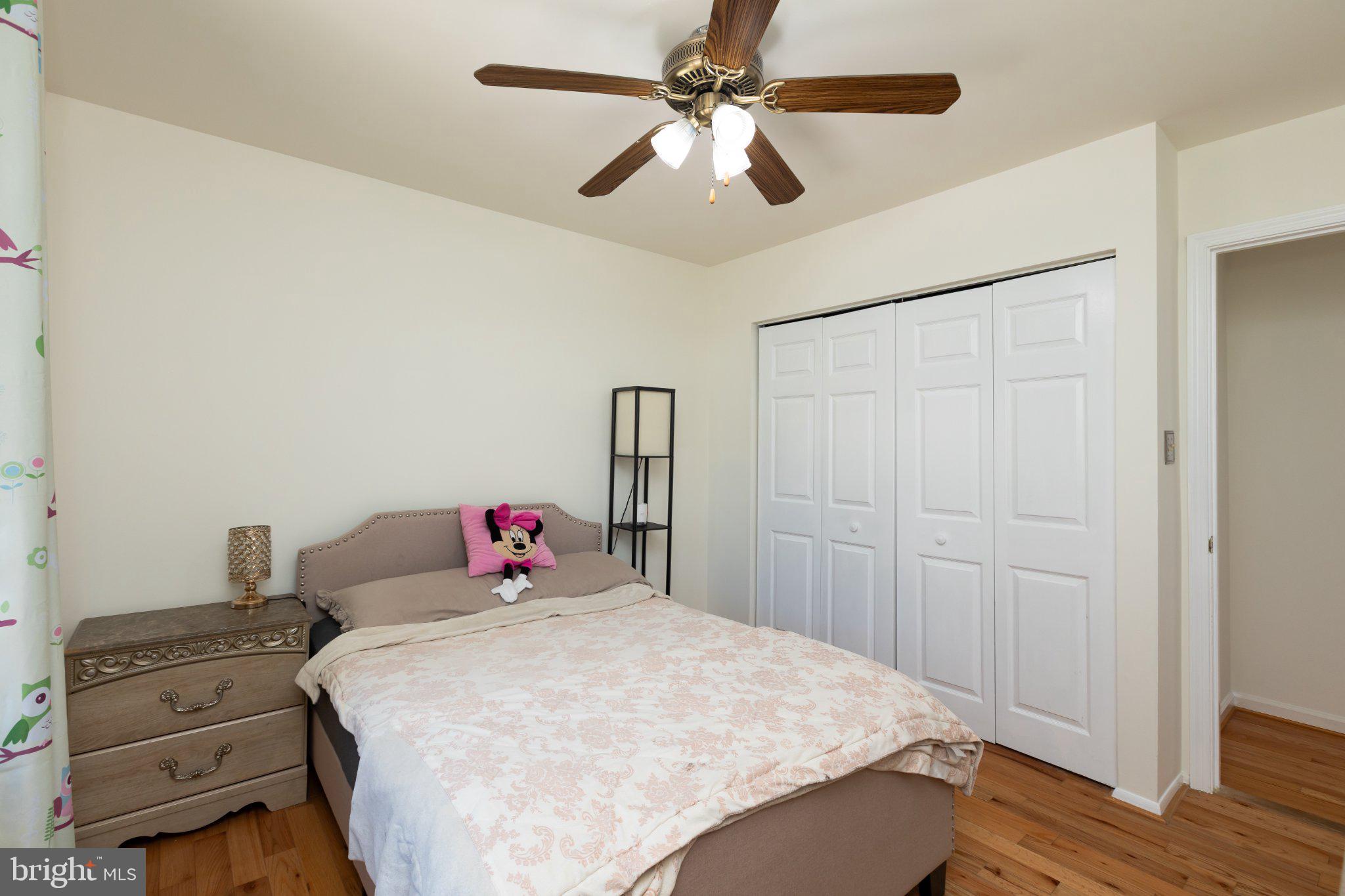 3613 Rusty Rim Ellicott City, MD 21043 - Photo 19 of 39 Cozy bedroom with warm wooden floors.