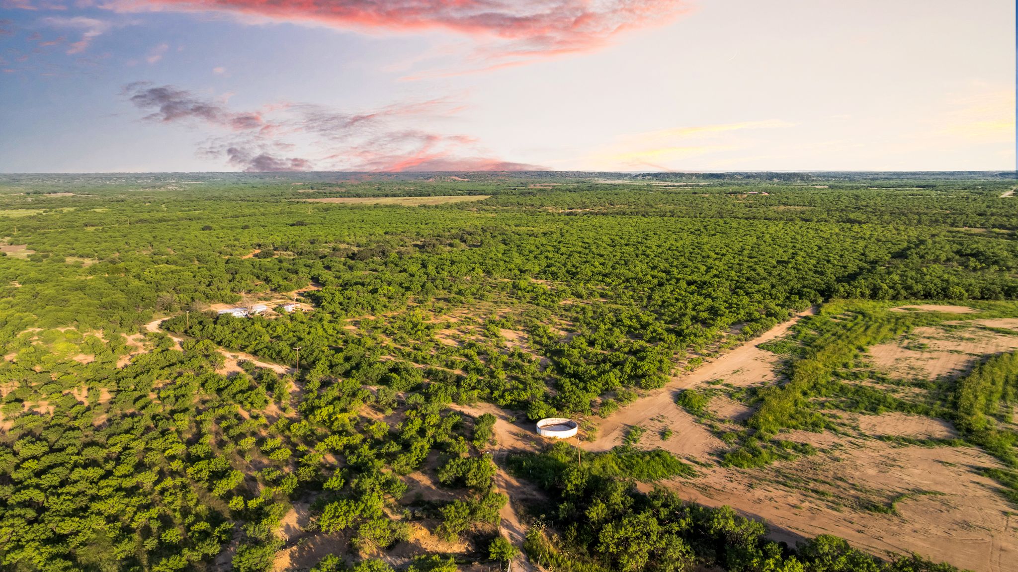2186 FM 1028 Rochelle, TX 76872 - Photo 2 of 19 Aerial view at dusk of a view of trees