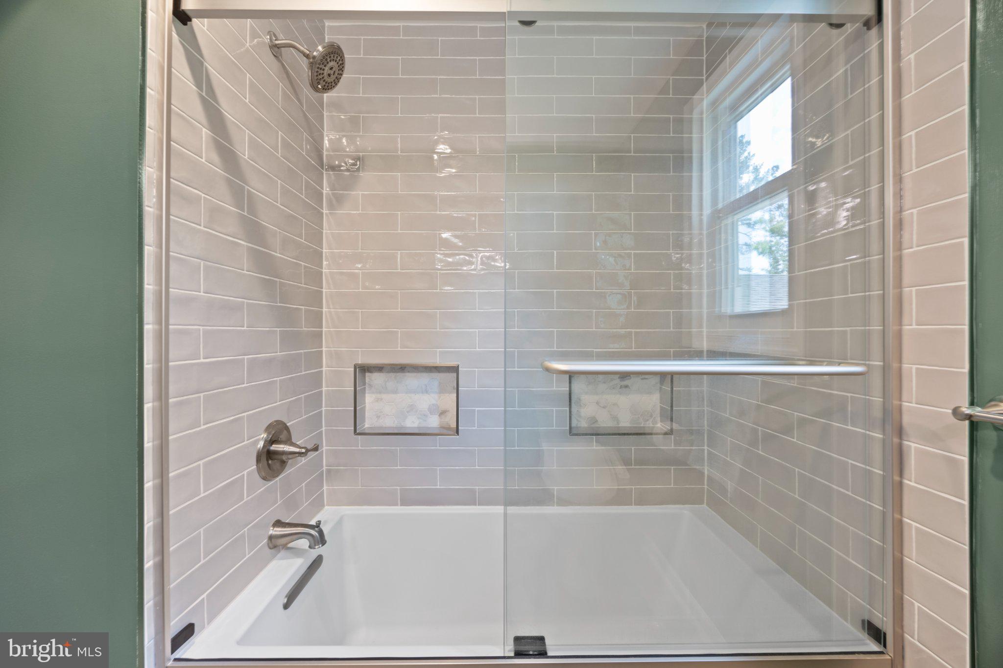 6705 New Hope Drive Springfield, VA 22151 - Photo 41 of 67 Sleek modern shower with glass enclosure.