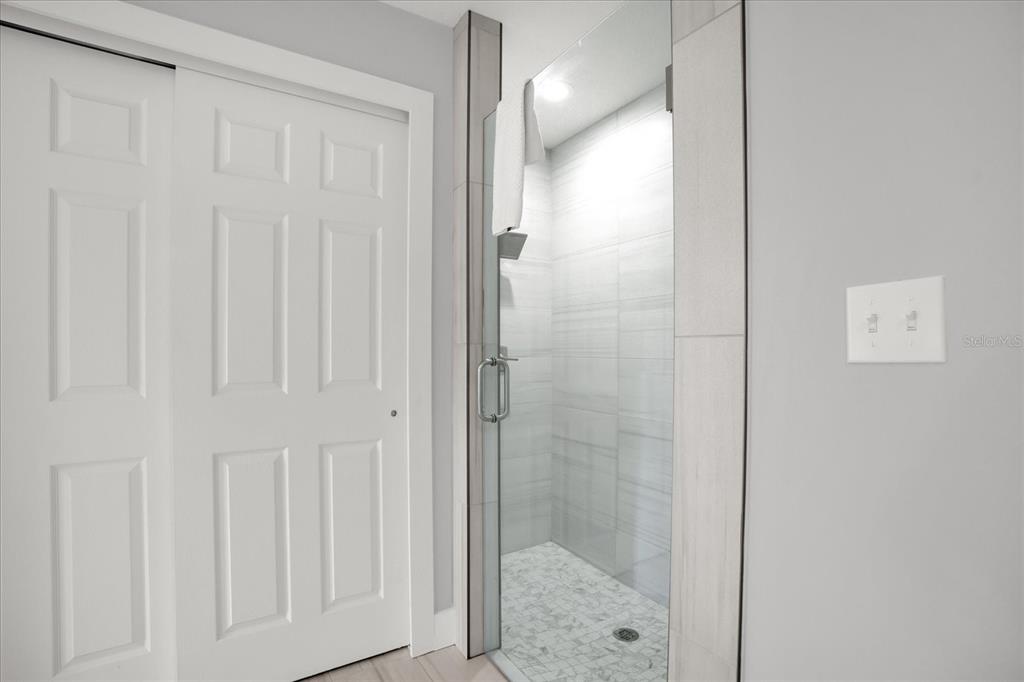 8774 Worldquest Boulevard Orlando, FL 32821 - Photo 12 of 35 a bathroom with a shower