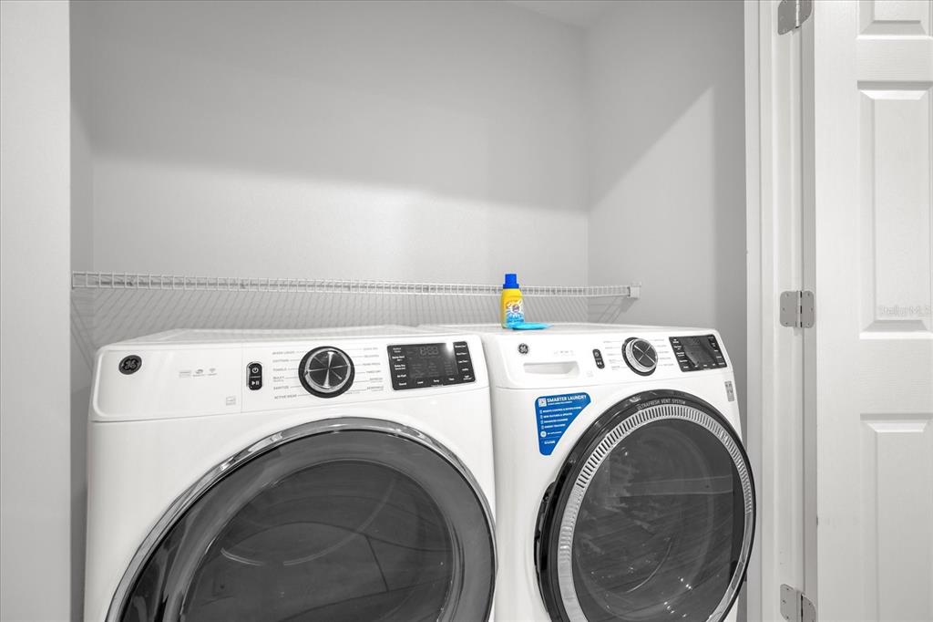 8774 Worldquest Boulevard Orlando, FL 32821 - Photo 24 of 35 a utility room with dryer and washer