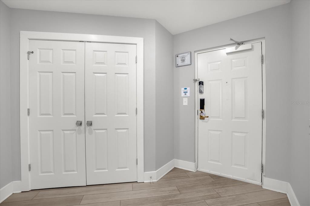 8774 Worldquest Boulevard Orlando, FL 32821 - Photo 25 of 35 a view of an empty room with wooden floor