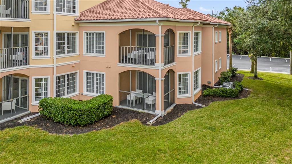 8774 Worldquest Boulevard Orlando, FL 32821 - Photo 31 of 35 front view of a house with a yard