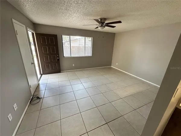 a view of an empty room with a window