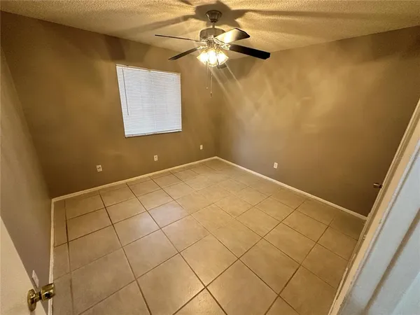 a view of empty room with fan