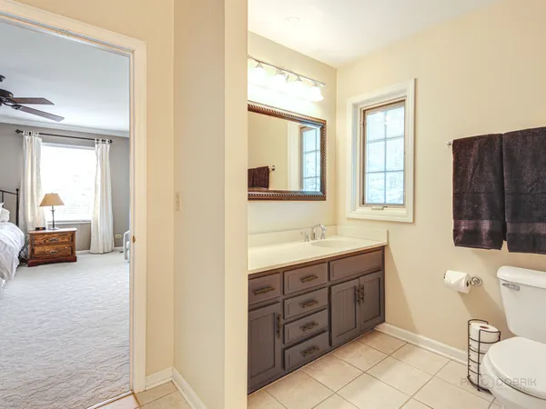 a bedroom with two beds and a window