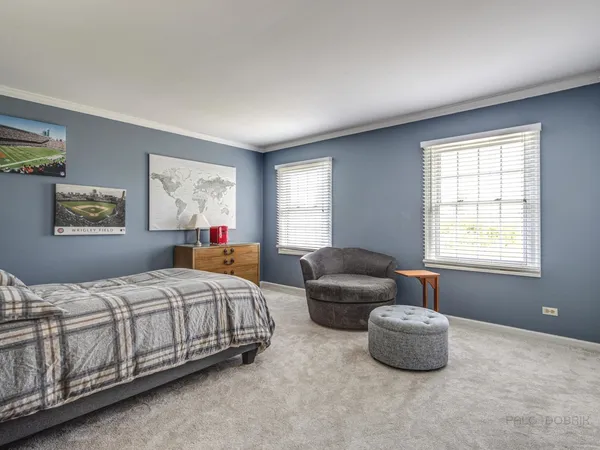 a room with wooden floor and furniture