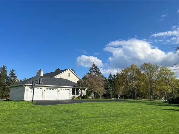 a view of a house with a tree