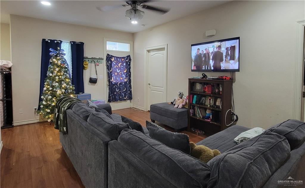 113 Spears Street San Benito, TX 78586 - Photo 12 of 15 a living room with furniture and a flat screen tv