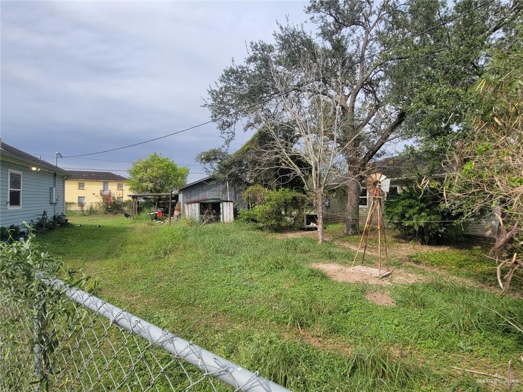 113 Spears Street San Benito, TX 78586 - Photo 15 of 15 a view of a yard and front view of a house