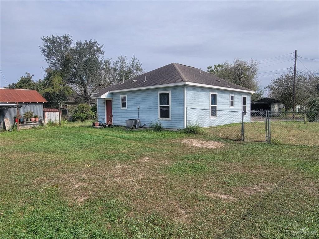 113 Spears Street San Benito, TX 78586 - Photo 2 of 15 a view of a house with yard and a tree