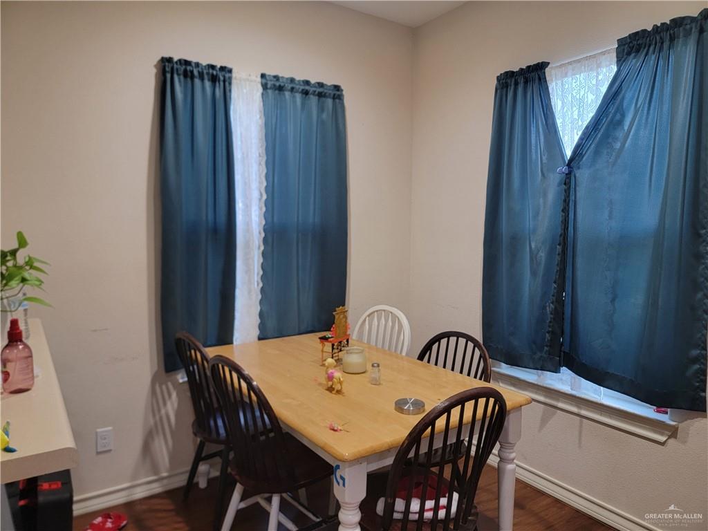 113 Spears Street San Benito, TX 78586 - Photo 4 of 15 a view of a dining table and chairs