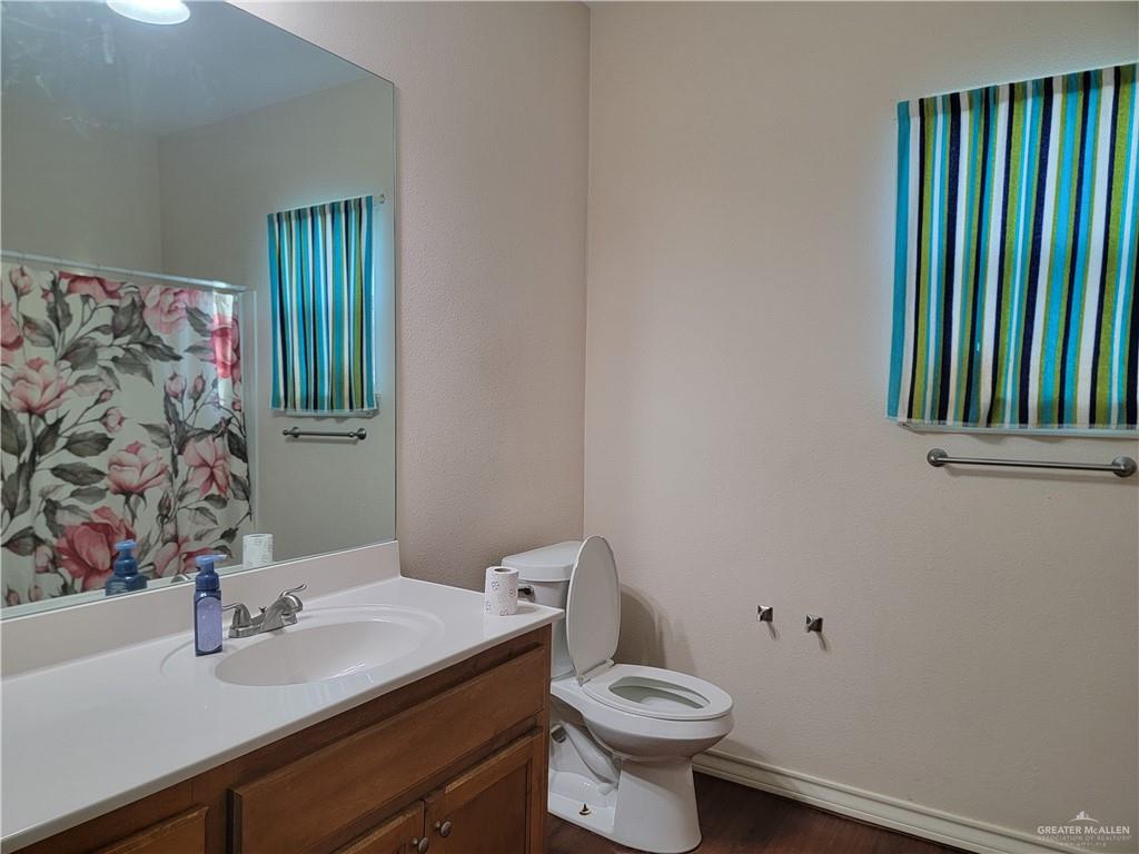 113 Spears Street San Benito, TX 78586 - Photo 5 of 15 a bathroom with a sink and a mirror