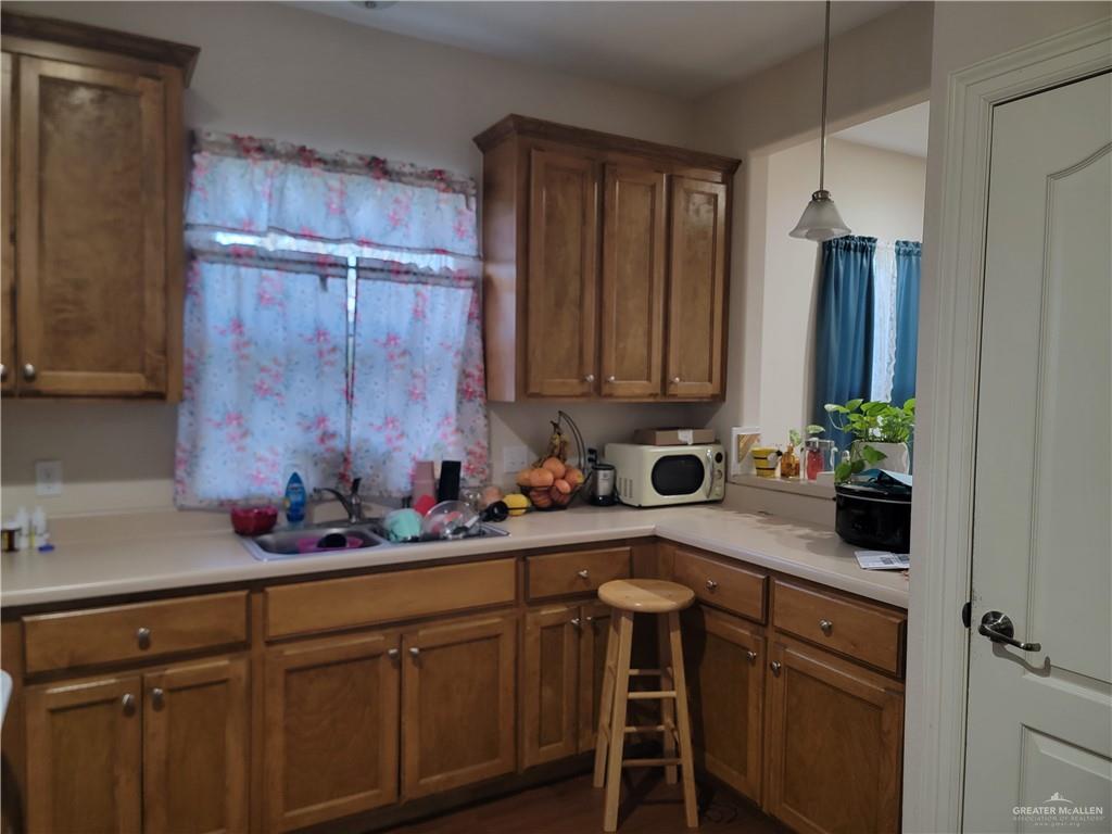 113 Spears Street San Benito, TX 78586 - Photo 6 of 15 a kitchen with a sink cabinets and window