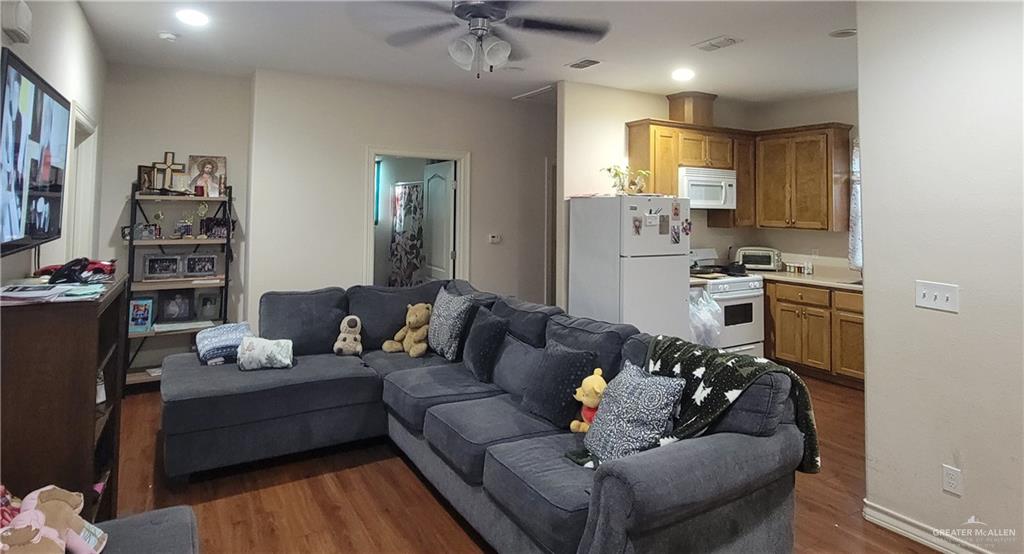 113 Spears Street San Benito, TX 78586 - Photo 8 of 15 a living room with furniture and a chandelier