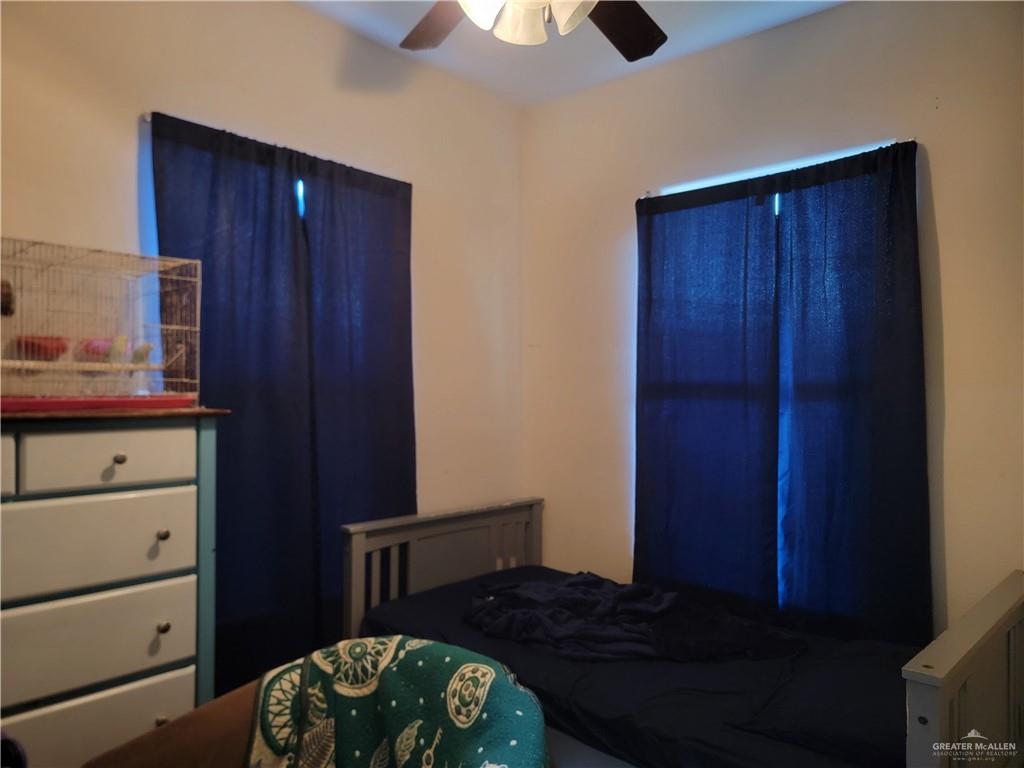 113 Spears Street San Benito, TX 78586 - Photo 9 of 15 a bedroom with a bed and a dresser