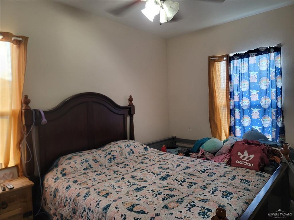 113 Spears Street San Benito, TX 78586 - Photo 10 of 15 a bedroom with a bed and a dresser