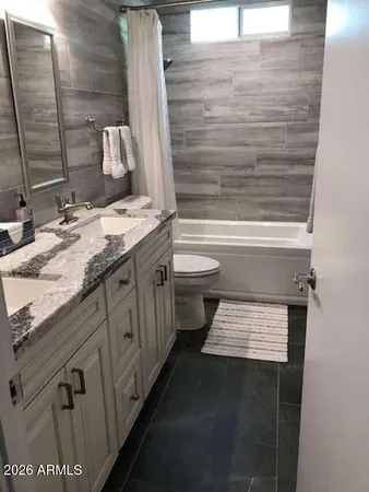 a view of a kitchen with a sink and a window