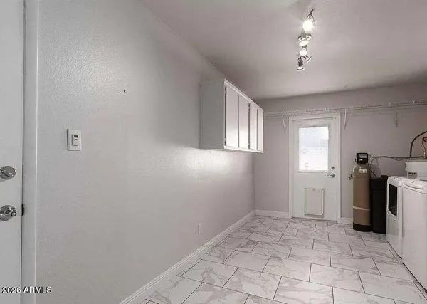 a front view of a house with parking area