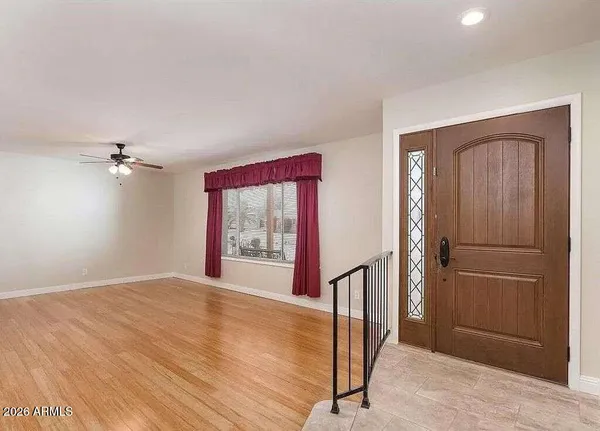 a view of an empty room with a window