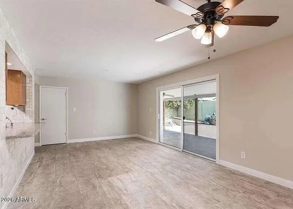 an empty room with a empty space and a window