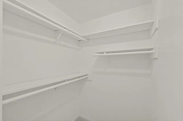 a view of an empty walk in closet