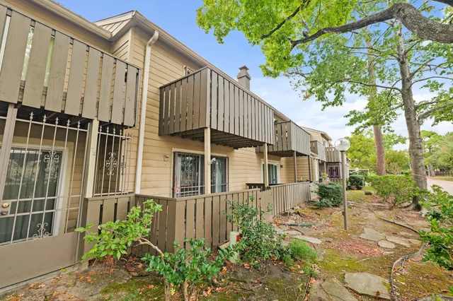 a house view with a garden space
