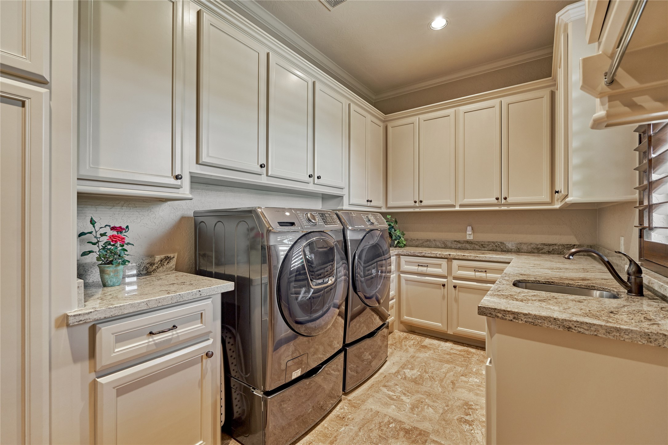 24803 Pearl Crest Lane Spring, TX 77389 - Photo 40 of 50 Utility room with sink, and an abundance of cabinetry and counterspace. Note: there is an additional stacked washer/dryer in the primary bedroom closet.