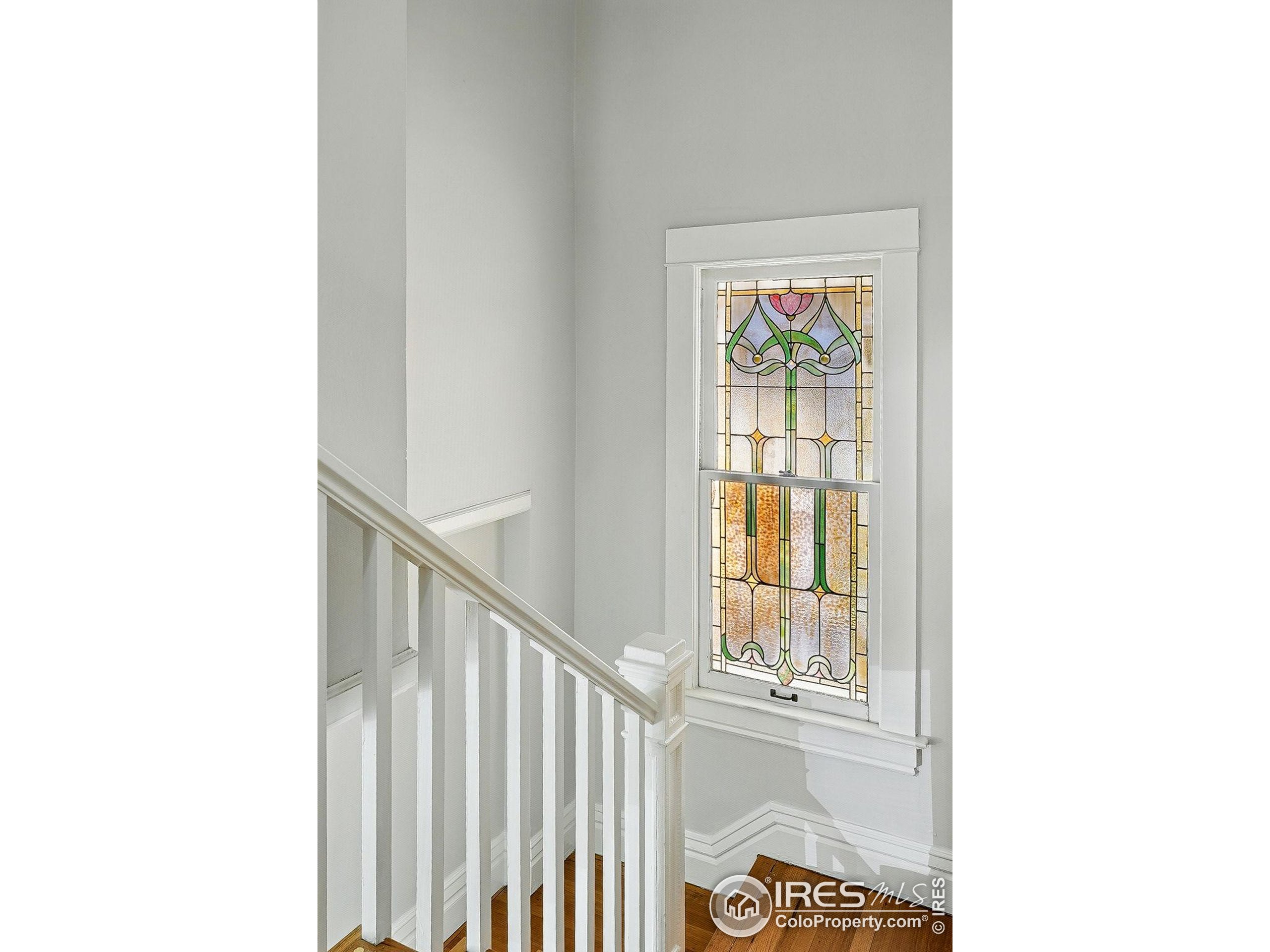 1582 Steele Street Denver, CO 80206 - Photo 23 of 48 a view of a hallway with windows